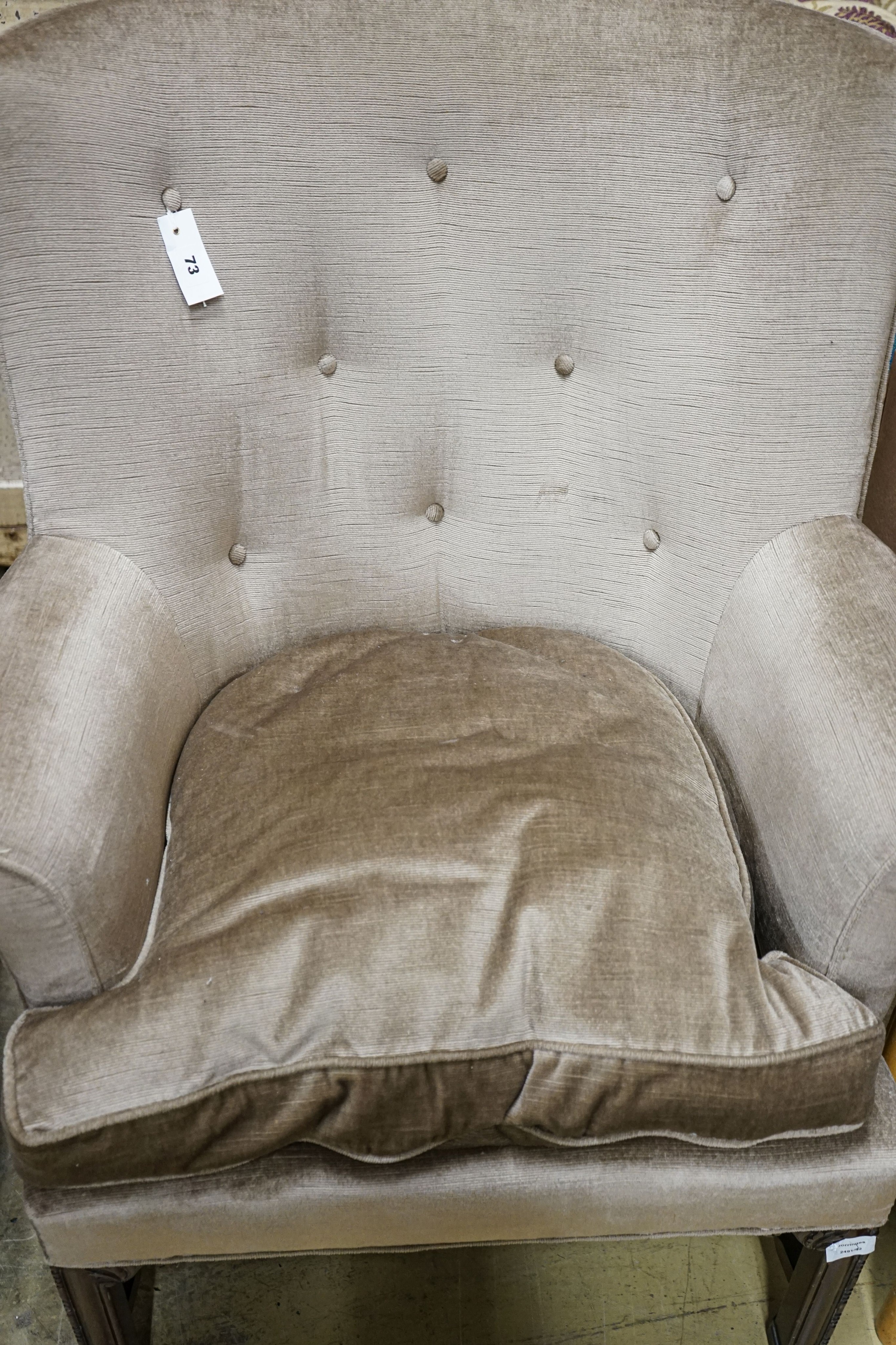 A George III style mahogany wing armchair, with carved squared legs, width 79cm, depth 60cm, height 101cm